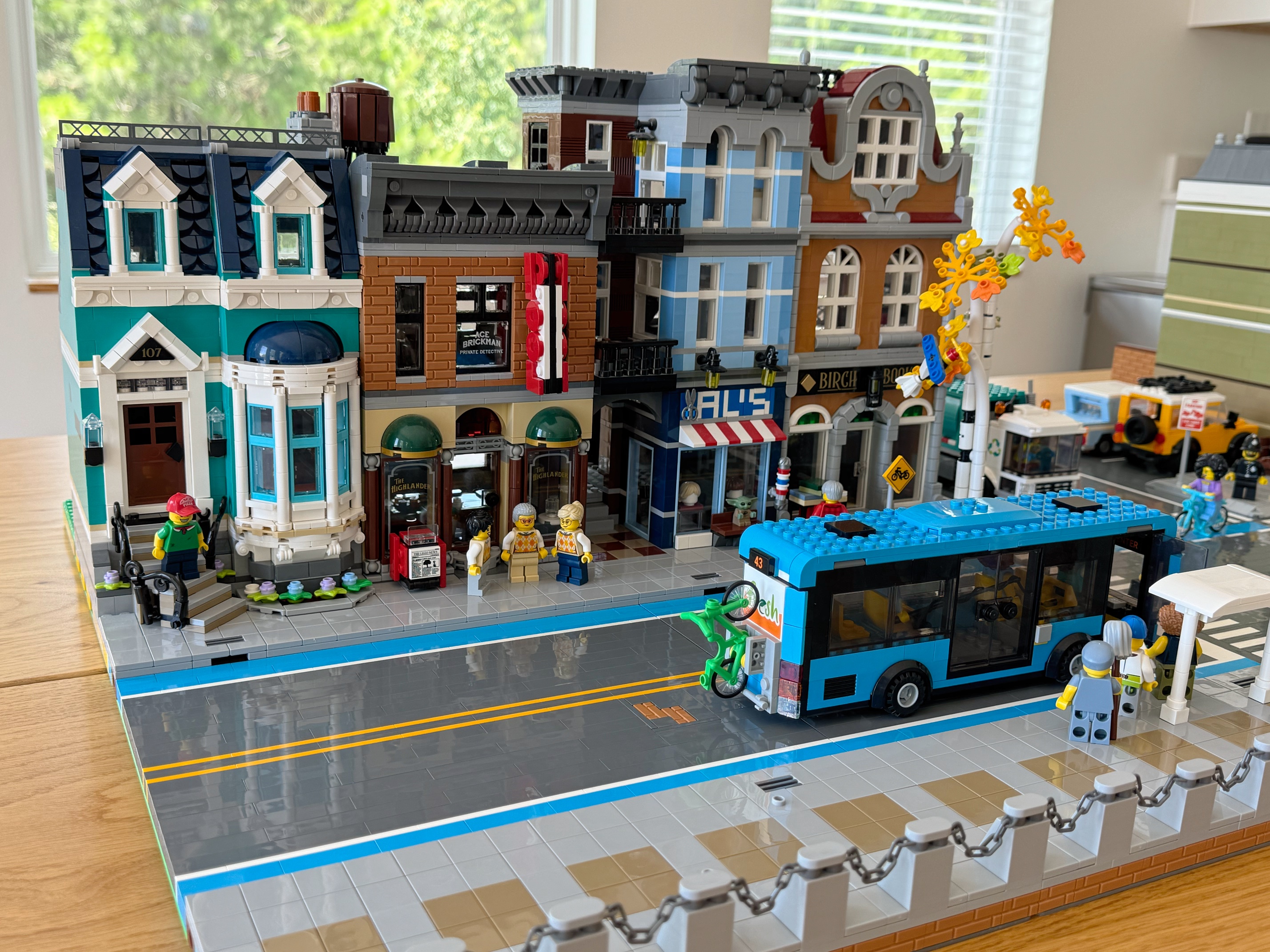 LEGO detective's office between a teal row home and bookshop