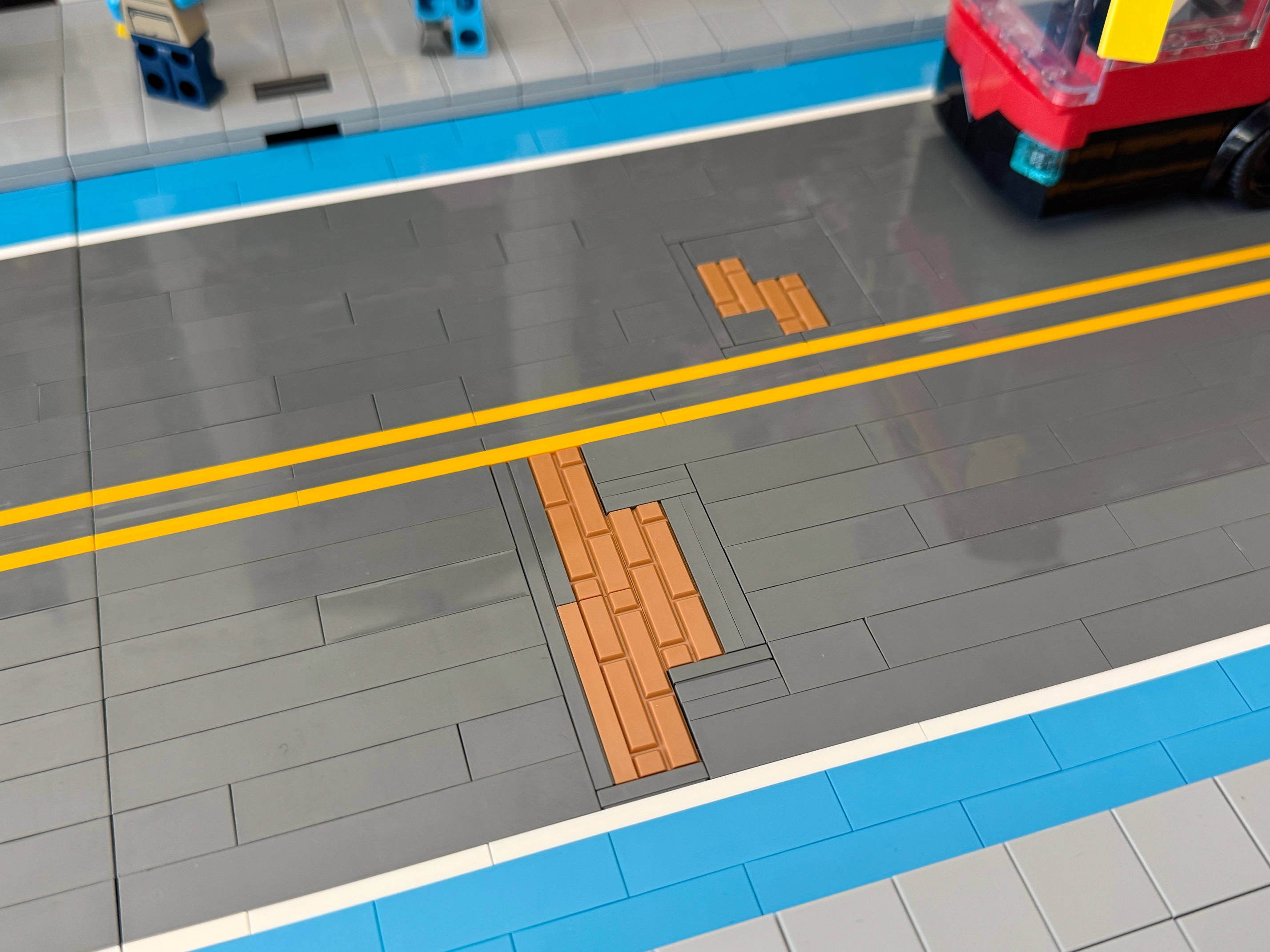 A brick-built LEGO road with exposed brick